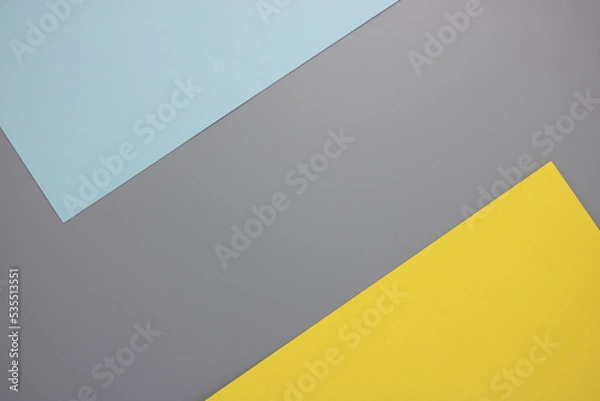 Fototapeta Flat lay. Top view blank yellow, blue and gray paper background, design yellow corner with copy space. Trendy theme of color of the year 2021. Ultimate gray and Illuminating. Color paper background.