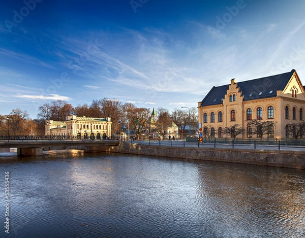 Obraz Budynki w Uppsali nad rzeką