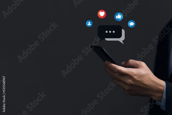 Fototapeta Businessmen use smartphones to communicate online on social media.	