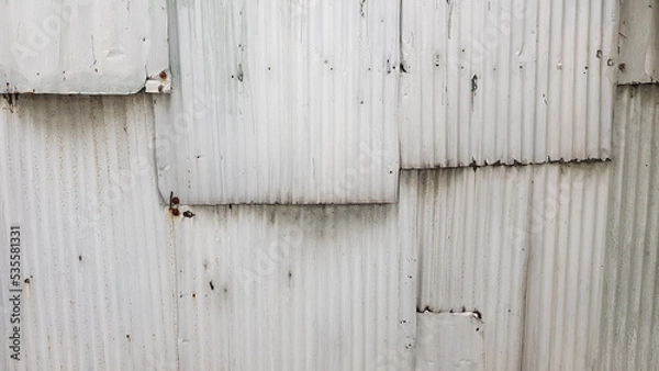 Fototapeta The walls are made of galvanized overlapping, painted white.
