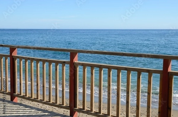 Obraz Handrail on litoral path the sea in Marbella, Spain