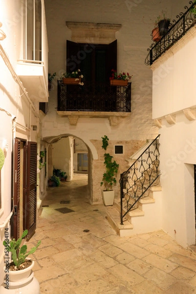 Fototapeta Historic district of Locorotondo at night. Locorotondo is an Italian municipality of about 14000 inhabitants in the metropolitan city of Bari, Apulia region.