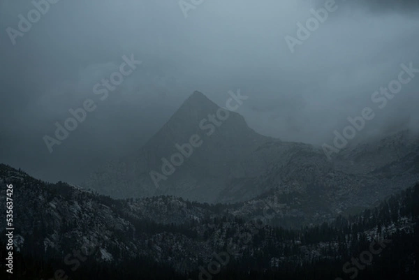 Fototapeta A mountain veiled in fog