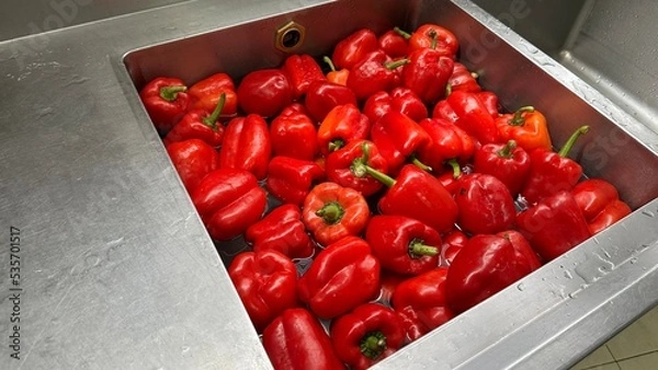 Obraz Red bell peppers soaked in water, washed and cleaned