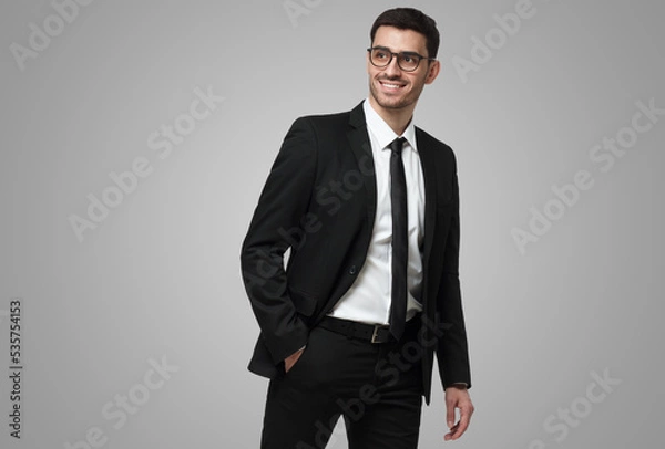 Fototapeta Business man walking in studio, making step, wearing formal suit, isolated on grey background