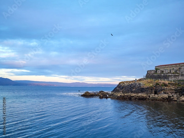 Fototapeta Sunset on the coast, a picture postcard image