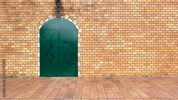 Obraz 緑色のドアとレンガの壁