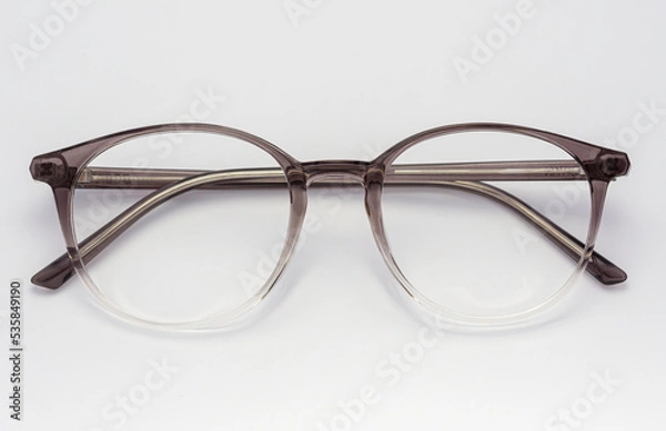 Obraz Eyeglass frames, lenses, various colors, both metal and plastic, on a beautiful colored background.