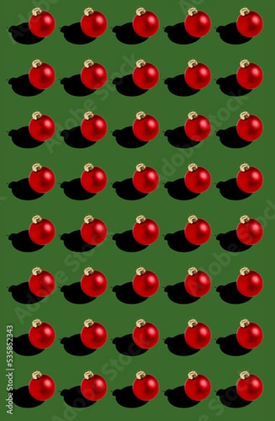 Fototapeta seamless red Christmas balls pattern on green background 