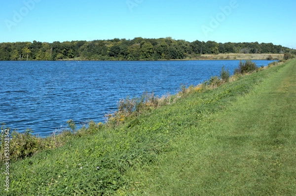 Obraz September 28, 2022. Shabbona Lake State Park, Shabbona, Illinois, USA. A view of part of the lake seen from the dirt dam.