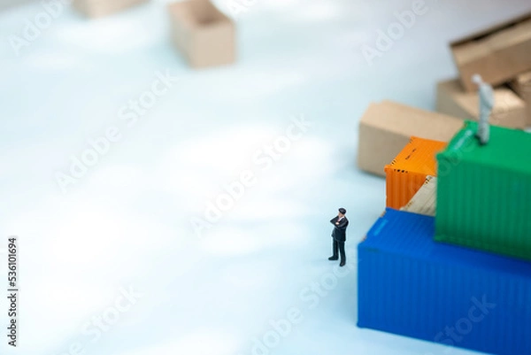 Fototapeta Miniature people: Businessman with copy space for text using as background transportation logistic business concept.