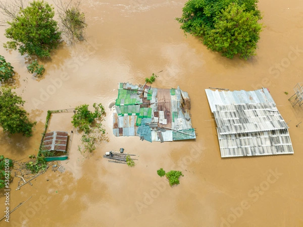 Fototapeta Aerial view of a flood in Southeast asian due to heavy rains and La Nina phenomenon.