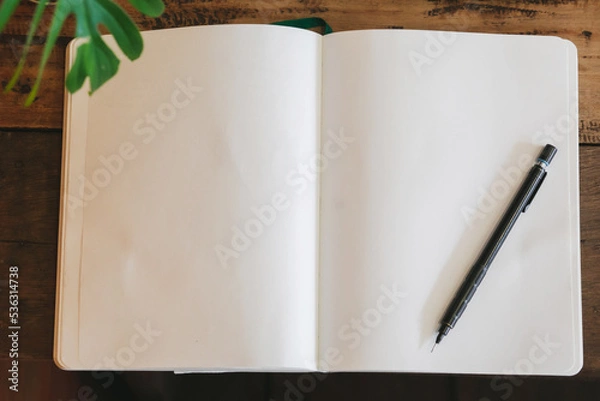 Fototapeta Notebook and pencil on wooden table