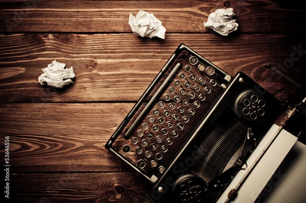 Obraz Vintage typewriter and a blank sheet of paper, retouching retro