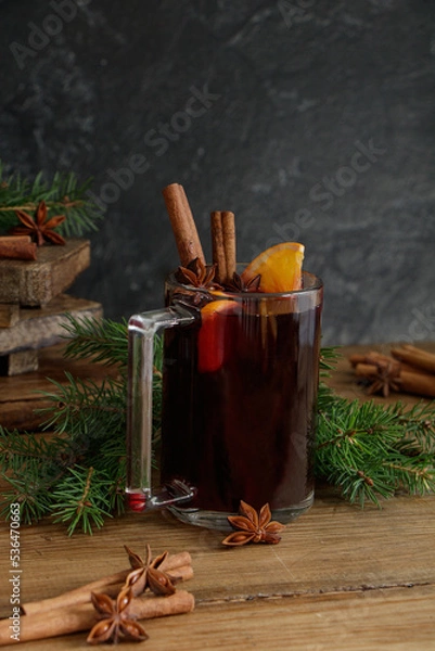 Fototapeta Christmas hot drink. Mulled wine. Delicious fragrant mulled wine with spices.
