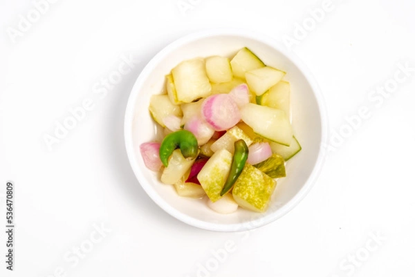 Obraz Typical Indonesian cucumber pickle, usually cucumber cut into squares with the addition of shallots and whole cayenne pepper
