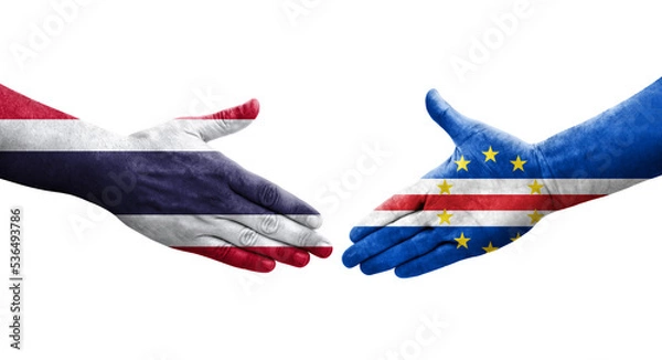 Fototapeta Handshake between Cape Verde and Thailand flags painted on hands, isolated transparent image.