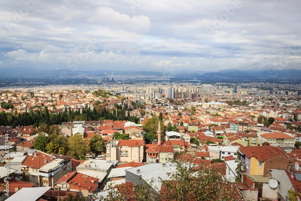Fototapeta Aerial view of Bursa city with cloudy sky. Bursa is touristic destination in Turkey.