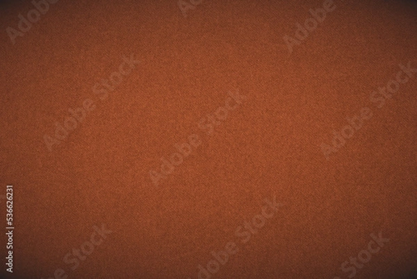 Fototapeta Bright brown colored paper texture. Dark orange tinted background or wallpaper with vignetting. Textured surface, fibers and irregularities are visible. Top-down