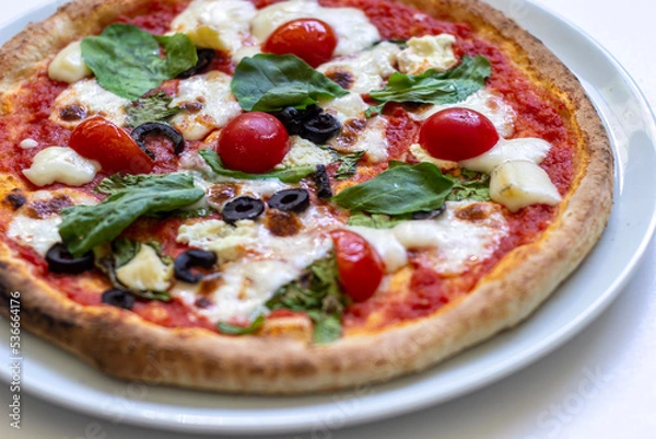 Obraz pizza with salami and tomatoes