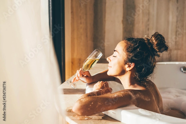 Obraz Beautiful woman relaxing at spa. Young lady relaxing in jacuzzi.