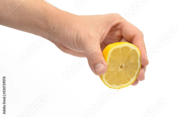 Obraz human hand squeezing lemon large pan on white background