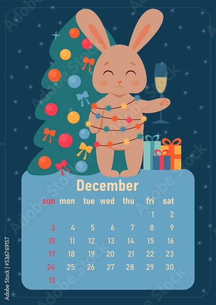 Fototapeta Calendar 2023 for december. Year of rabbit, symbol of new year. The week starts on Sunday. A cute rabbit turned into garland with colored light bulbs, stands near Christmas tree with gifts with glass 