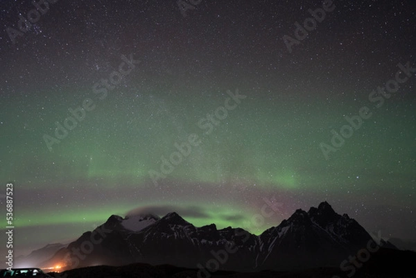 Obraz aurora borealis over the mountains