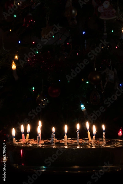 Fototapeta Christmas traditions, candle and nut craft