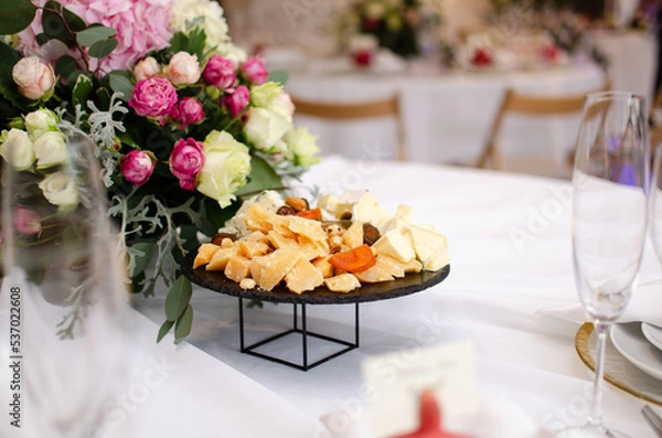 Obraz Beautiful wedding decoration. Banquet table setting and decoration. Flower decoration of wedding tables. Cutlery on the table.