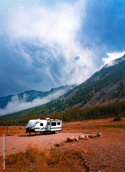 Fototapeta RV Camper Trailer In Autumn Fall Outdoor Mountain Landscape
