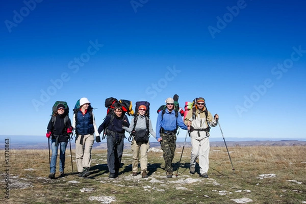 Fototapeta Group of hikers is walking on top of mountain in Crimea mountain