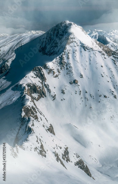 Obraz Beautiful high snowy mountain peak from above in the Austrian alps during a sunny afternoon.