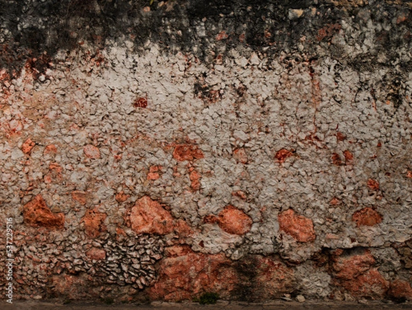 Fototapeta pattern gray color of modern style design decorative uneven cracked real stone wall surface with cement
