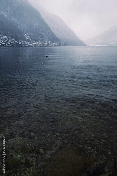 Obraz Mountain range with strong atmosphere during a snowy, dark winter afternoon