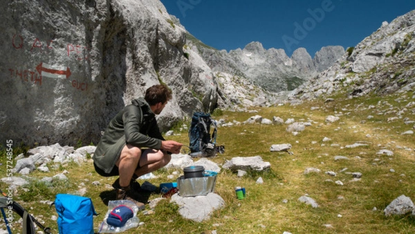 Fototapeta mountain view of the peaks of the Balkan. high mountains, blue skys. person in the middle

