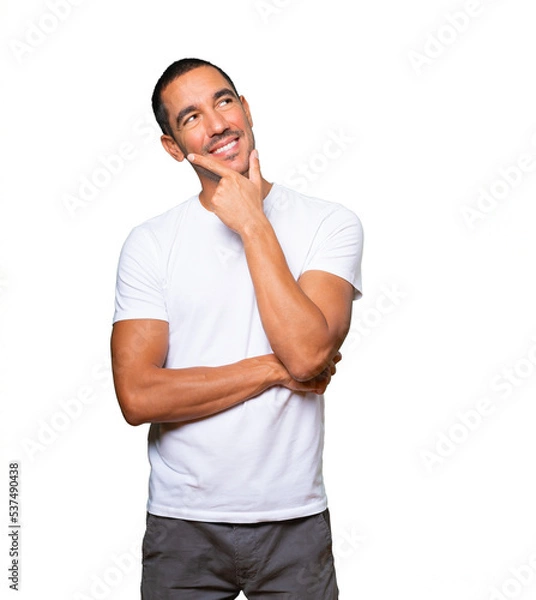 Obraz Happy young man making a gesture of doubt
