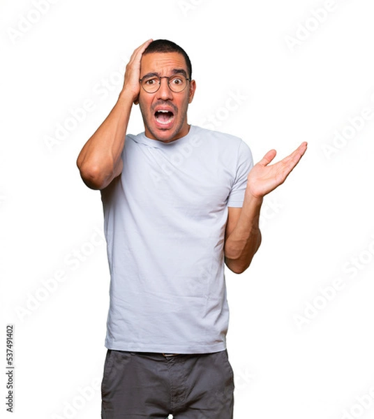 Obraz Crazy young man making a gesture of despair