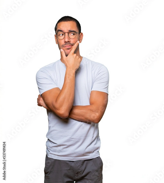 Obraz Concerned young man making a gesture of doubt