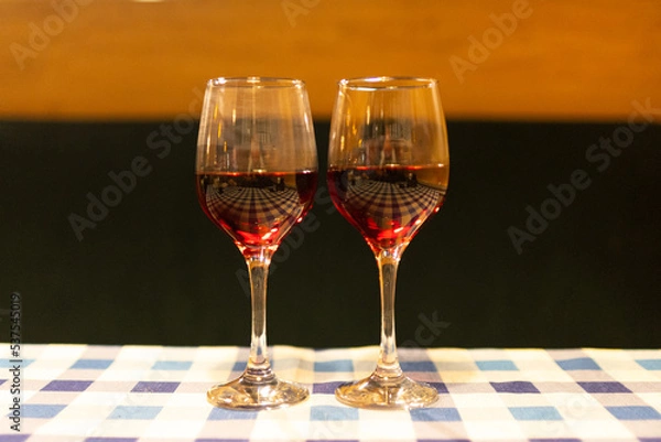 Fototapeta two glasses of red wine on the table