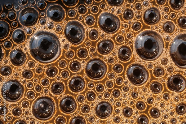 Fototapeta Close-up minimalistic, abstract photo of round bubbles of coffee's warm brown foam surface.