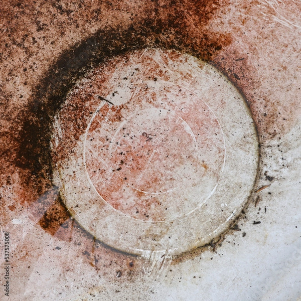 Fototapeta Circular circle rust spot on an iron plate. Abstract, minimalist color photo.