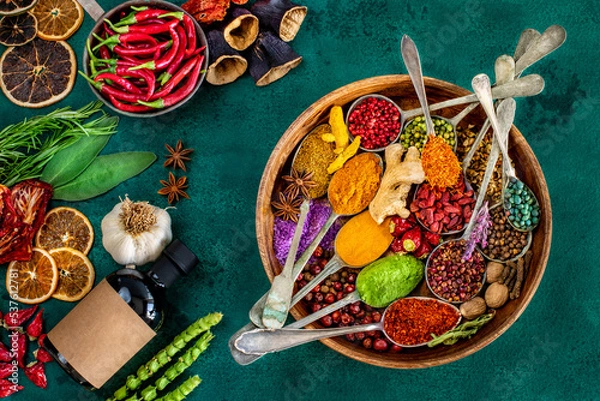 Fototapeta Various spices and dried fruits on the table.