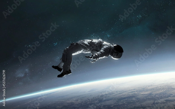 Obraz 3D illustration of astronaut falling to earth planet. 5K realistic science fiction art. Elements of image provided by Nasa