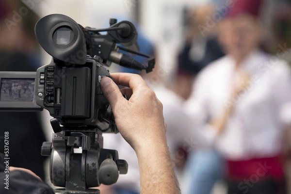 Fototapeta covering an event with a video camera
