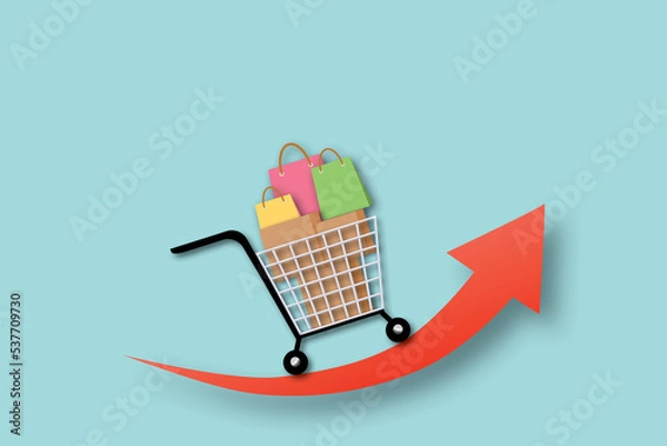 Fototapeta Shopping cart with paper bag and box on red arrow going up and pastel blue background. Concept of inflation and rising consumer goods prices. copy space for text. illustration paper cut design style.