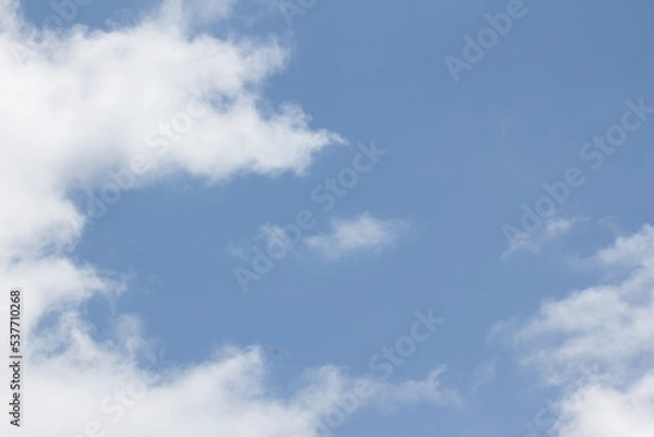 Obraz fluffy white clouds on a blue background
