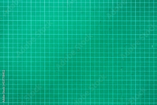 Fototapeta Plastic green cutting mat texture. squared sheet texture green background
