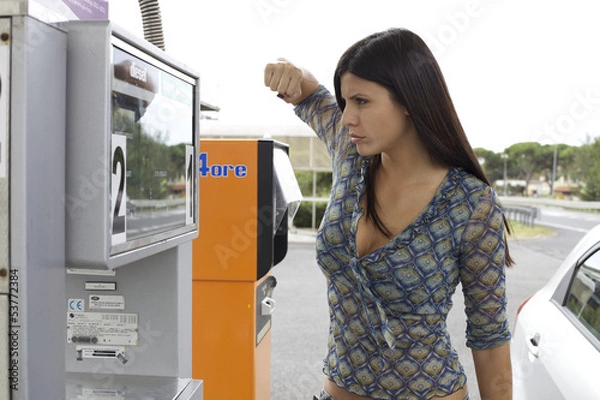 Obraz Woman willing to punch gas station