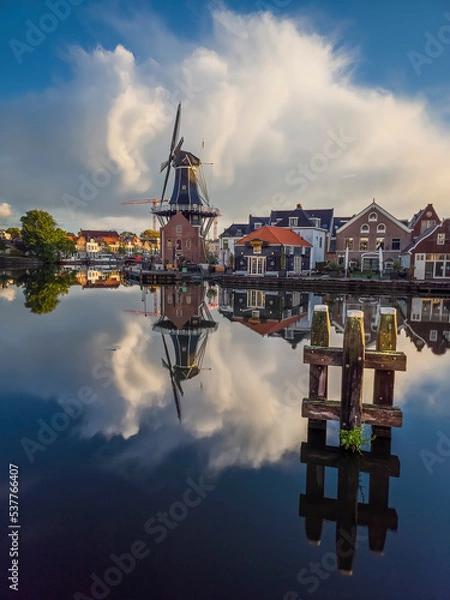Obraz Windmill de Adriaan on the Spaarne River in Haarlem in the Netherlands